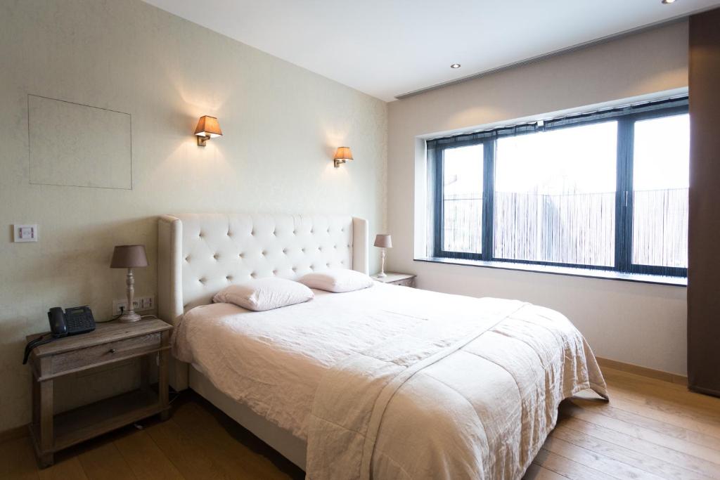 Postel nebo postele na pokoji v ubytování Hotel Den Berg