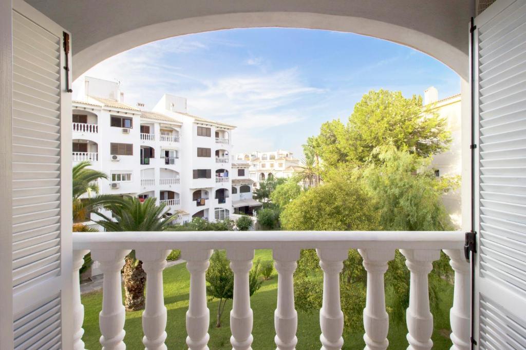 an open balcony with a view of a building at Espanatour Calas Blancas in Torrevieja