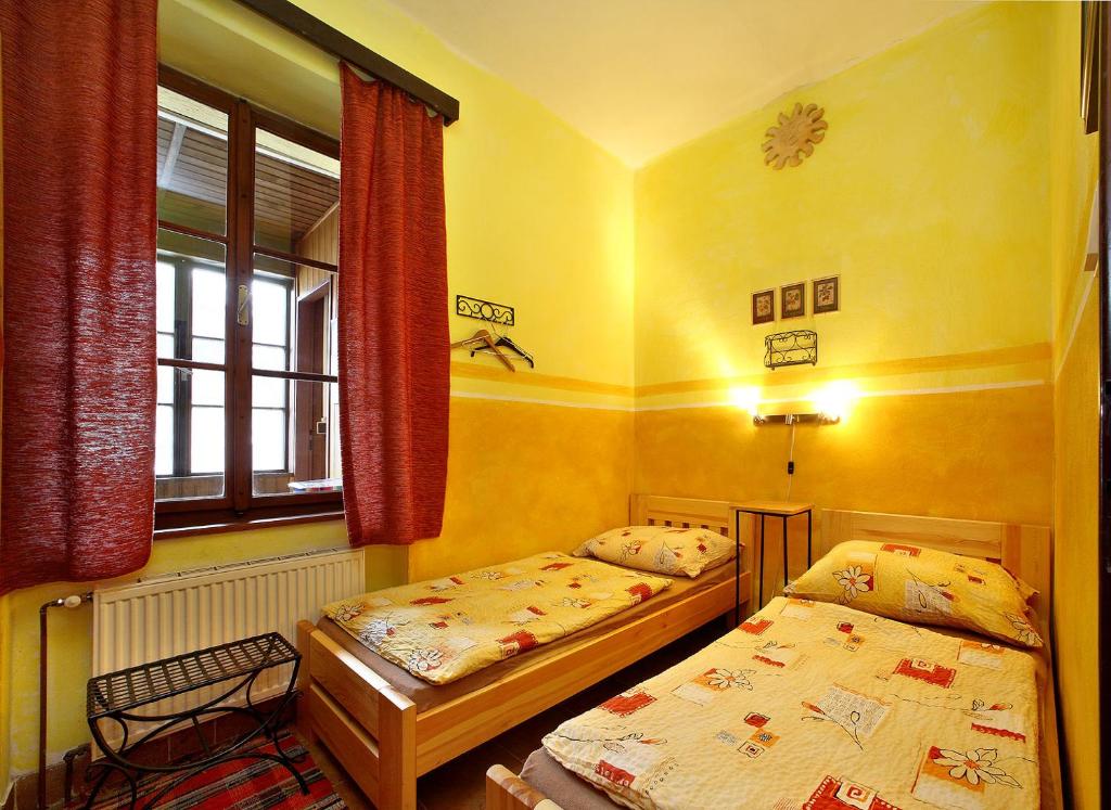 Ένα ή περισσότερα κρεβάτια σε δωμάτιο στο Hostel Merlin