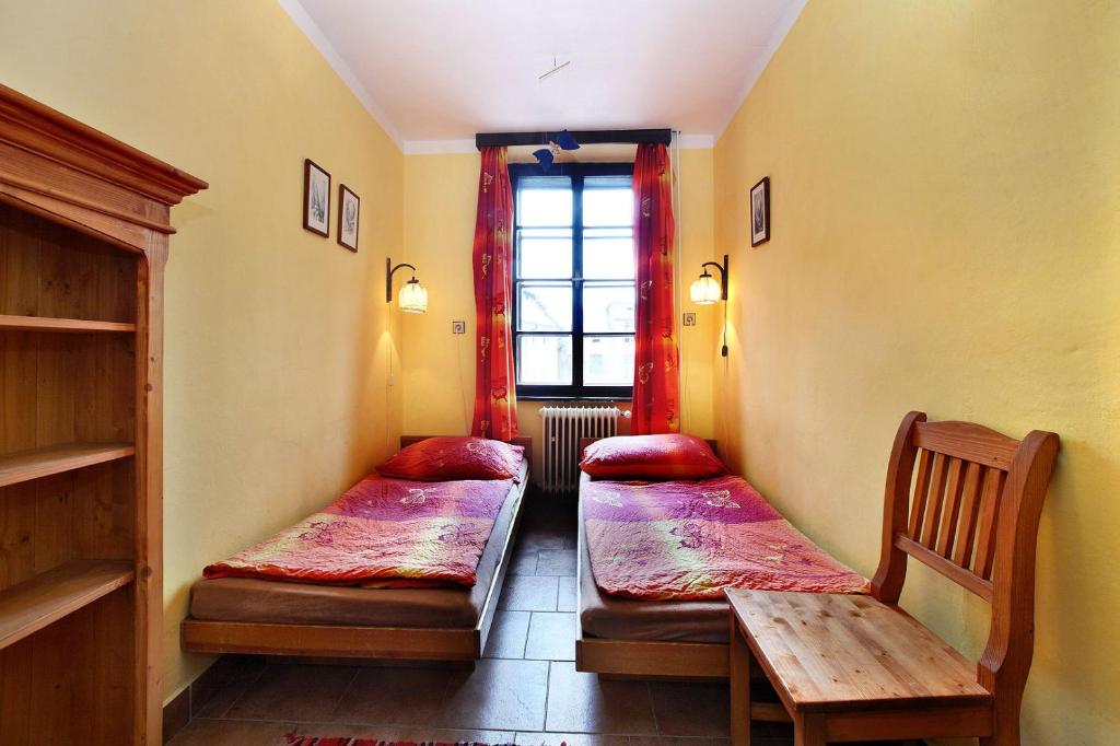 Ένα ή περισσότερα κρεβάτια σε δωμάτιο στο Hostel Merlin