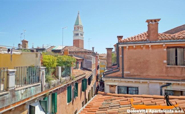 a group of buildings with a clock tower in the background at San Marco Martin 349 WI-FI in Venice