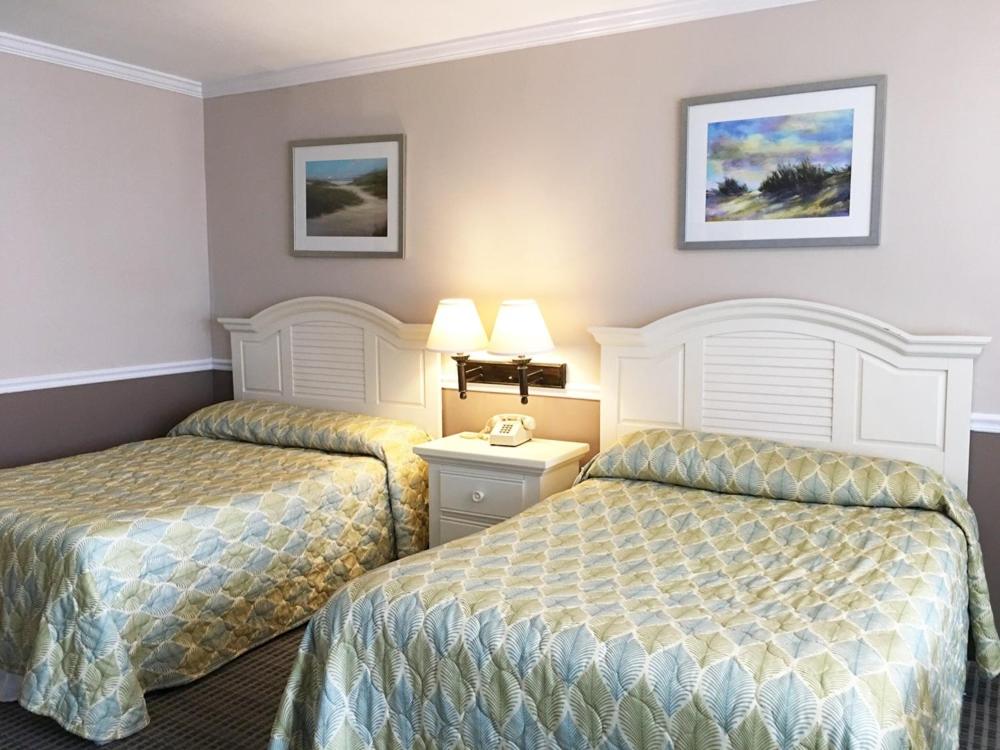 Postel nebo postele na pokoji v ubytování Aqua Beach Hotel