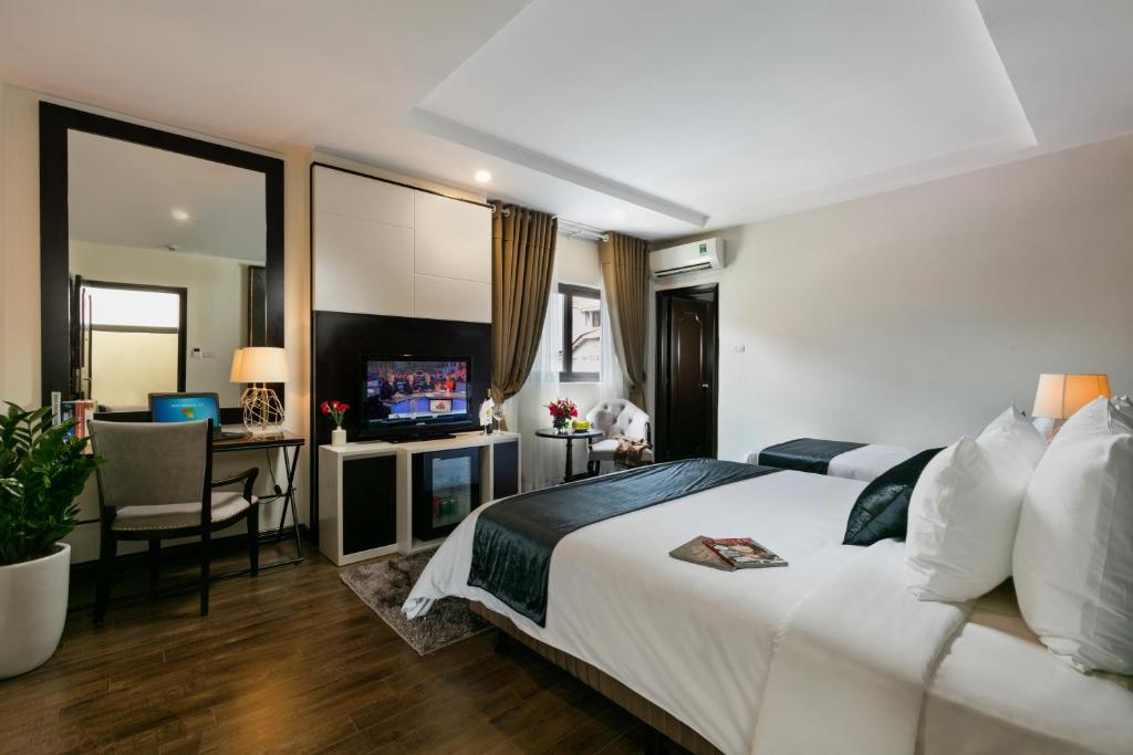 Postel nebo postele na pokoji v ubytování La Santé Hotel & Spa