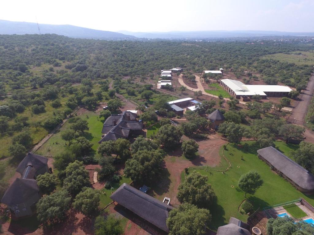 an aerial view of a village with houses and trees at Kareespruit Game Ranch & Guest House in Zeerust