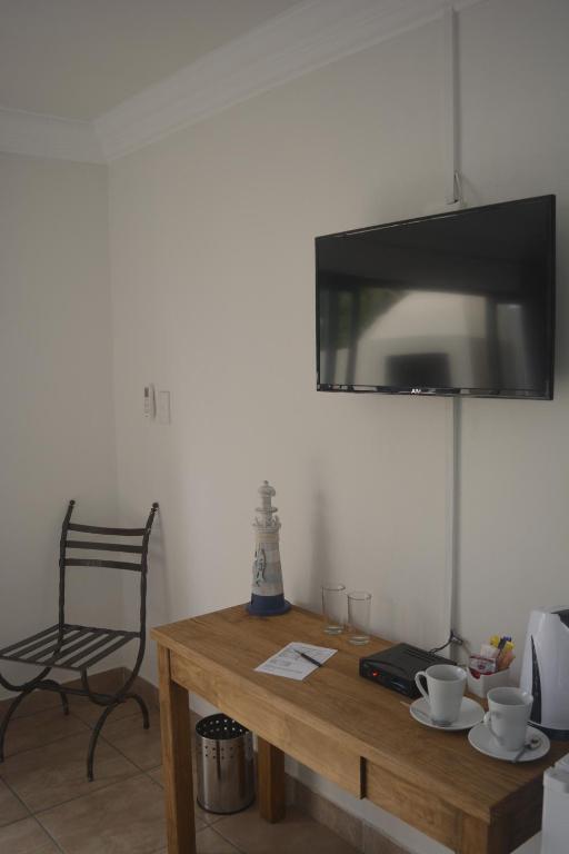 TV a/nebo společenská místnost v ubytování Beach Retreat Guesthouse