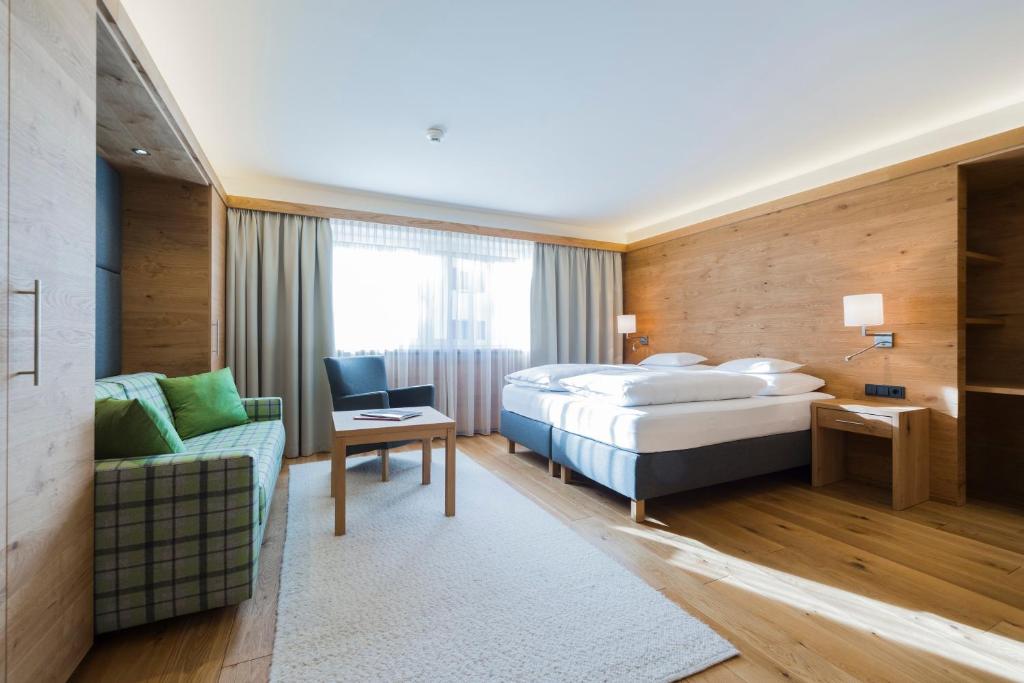 Postel nebo postele na pokoji v ubytování Hotel Garni Panorama