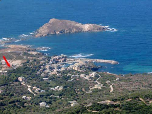an aerial view of an island in the ocean at Porteo - Les Terrasses du Port in Centuri