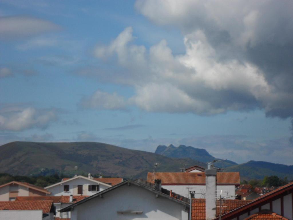 a view of a city with mountains in the background at Toki Alai in Saint-Jean-de-Luz