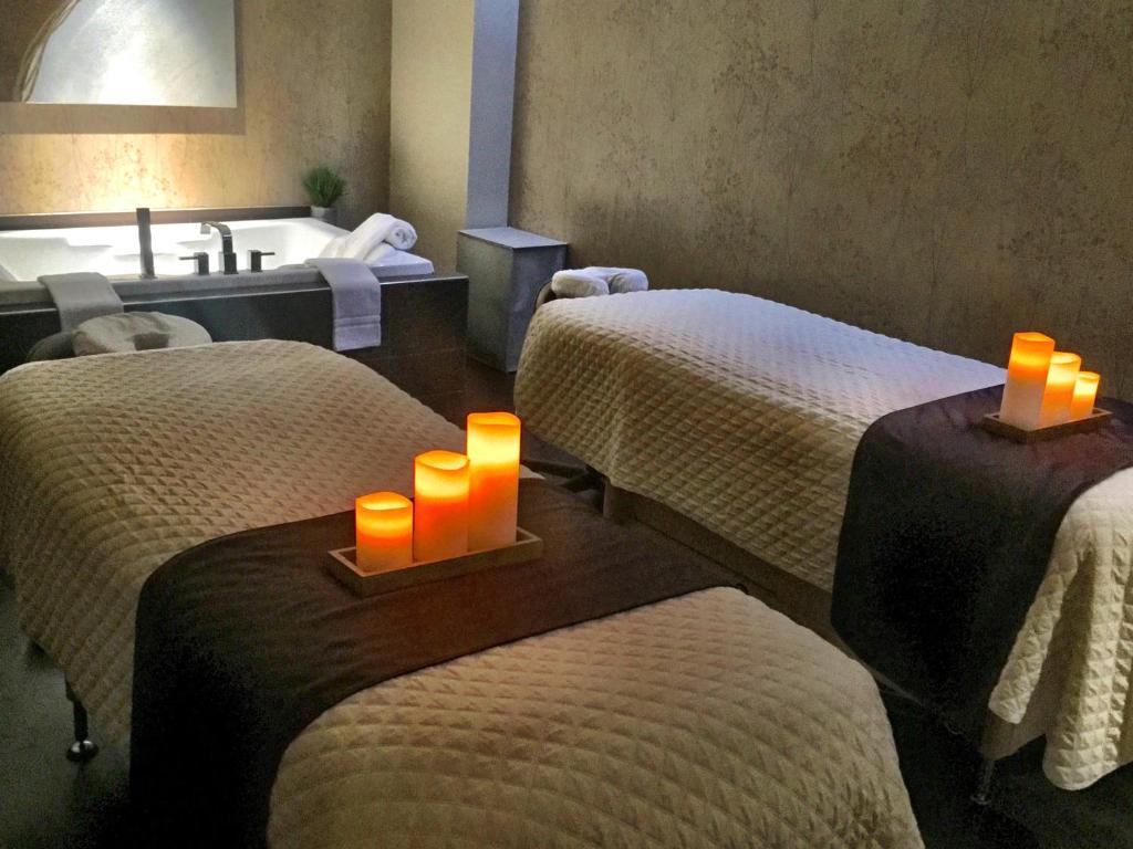 a hotel room with two beds with candles on them at Golden Nugget Biloxi in Biloxi