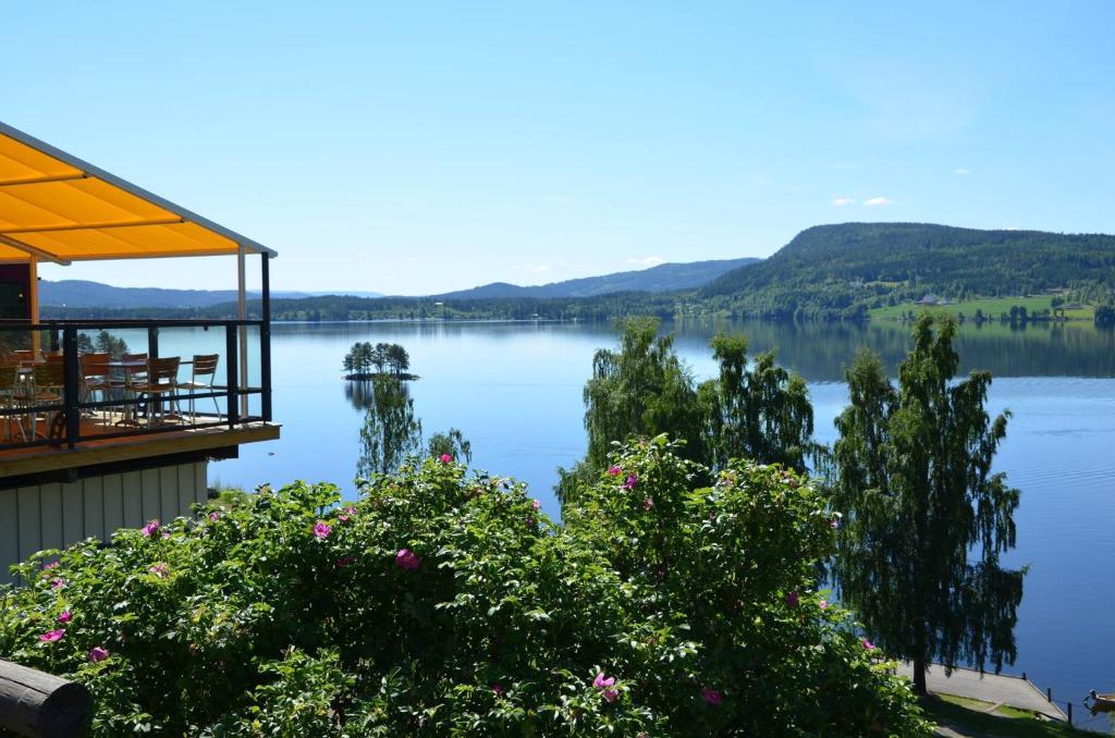 a view of a lake from a house at Kroderen Kro & motel AS in Hamremoen