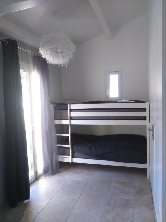 Postel nebo postele na pokoji v ubytování Le Jasmin