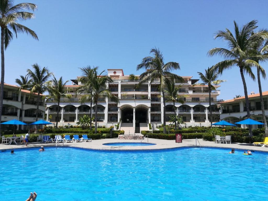 a large pool in front of a resort at Grand Marina Villas in Nuevo Vallarta