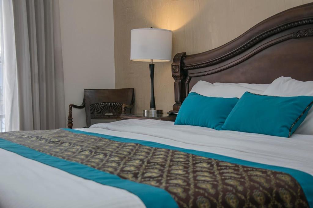 Postel nebo postele na pokoji v ubytování Hotel Colonial