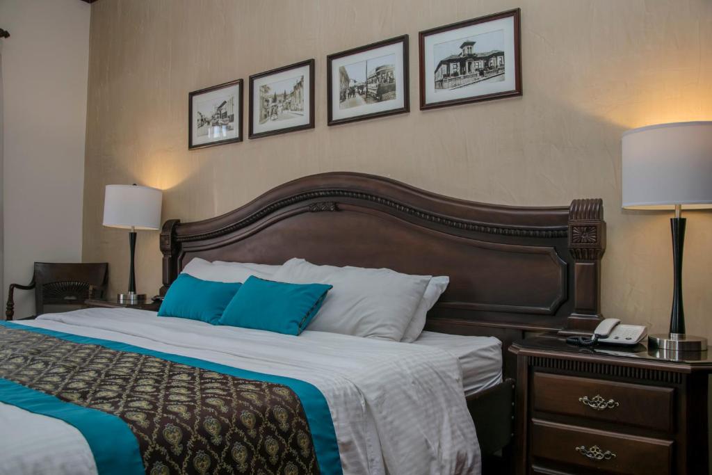 Postel nebo postele na pokoji v ubytování Hotel Colonial