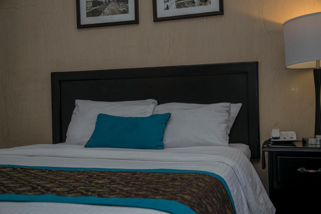 Postel nebo postele na pokoji v ubytování Hotel Colonial