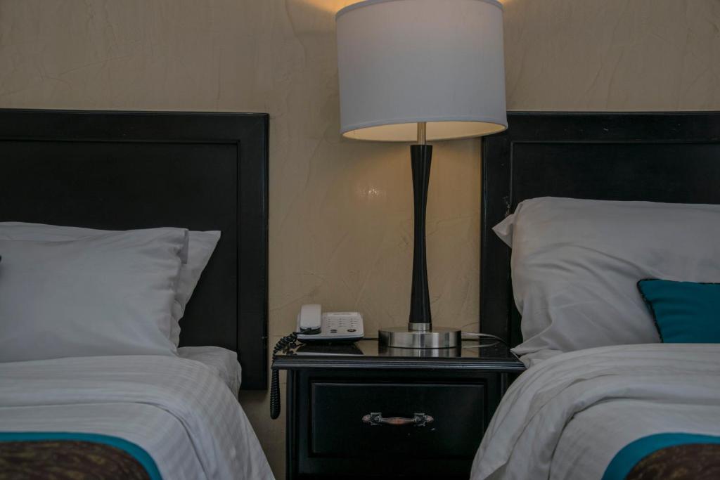 Postel nebo postele na pokoji v ubytování Hotel Colonial