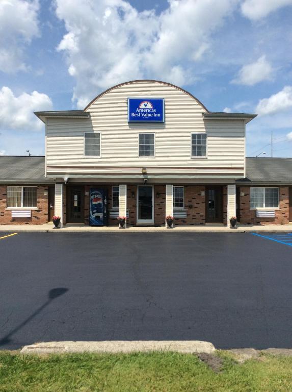 a building with a sign on the side of it at Americas Best Value Inn of Decatur in Decatur