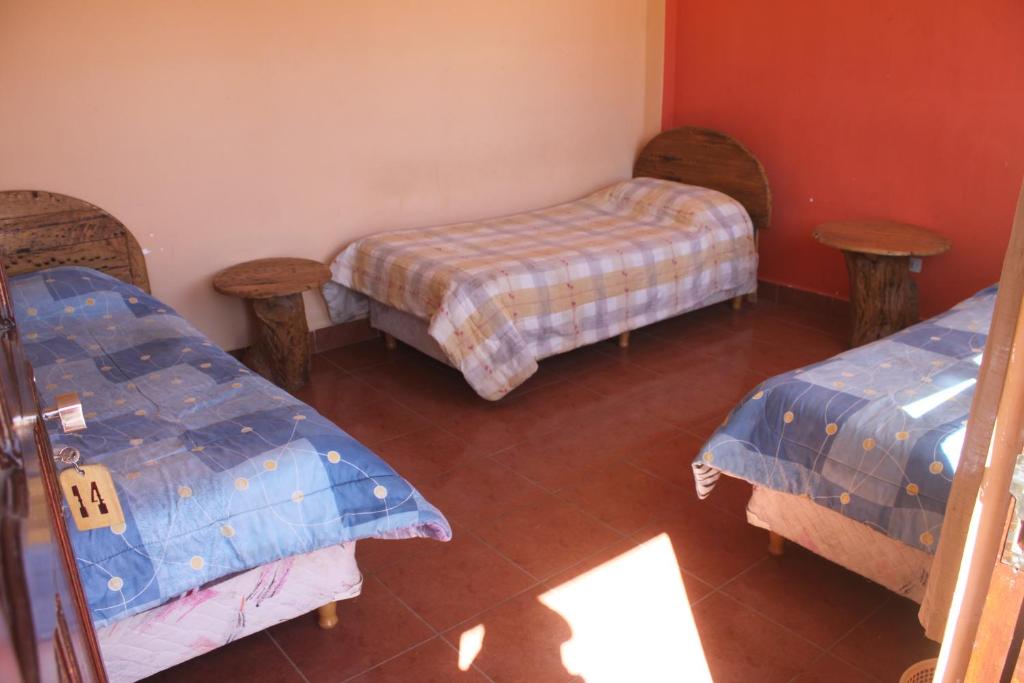 Hostal Coronel Pedro Arraya客房内的一张或多张床位