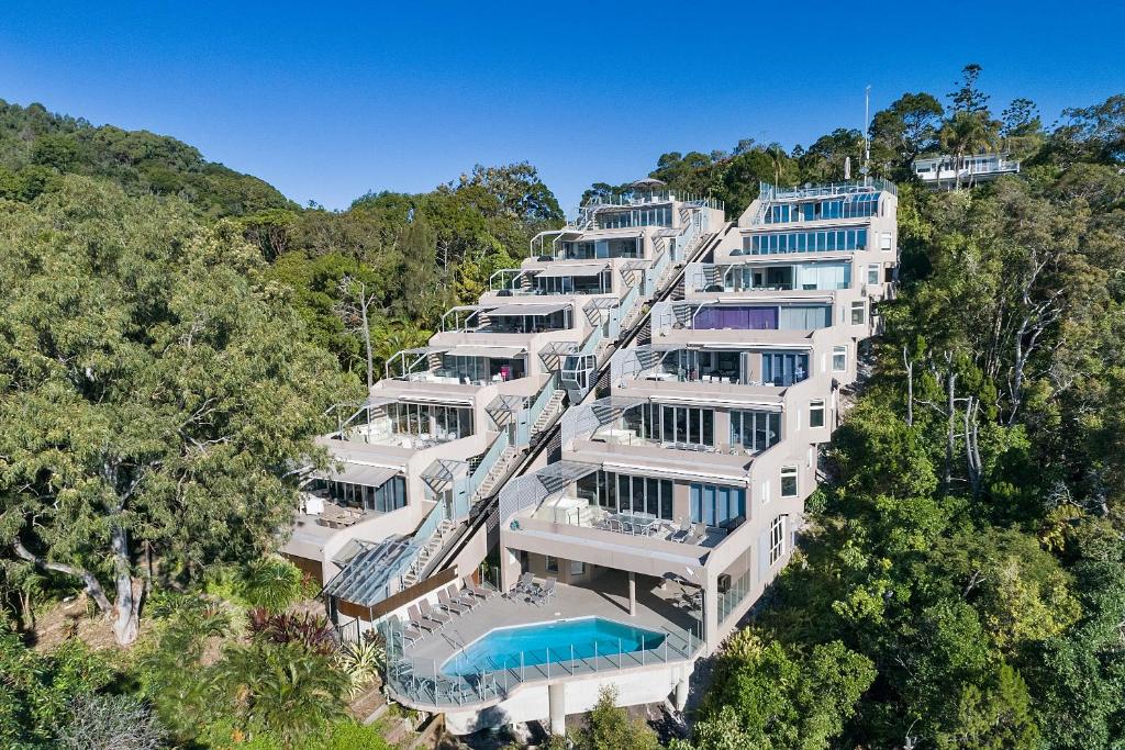 an aerial view of a large white building with a swimming pool at Picture Point Terraces in Noosa Heads