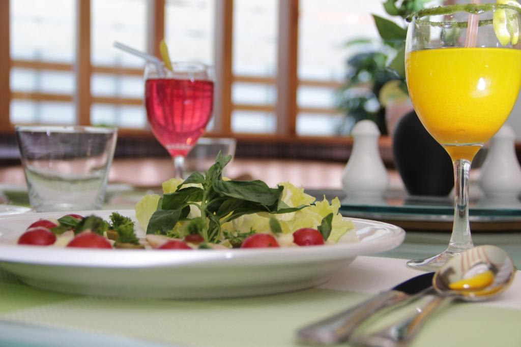 Nápoje v ubytování Hotel Green Olive