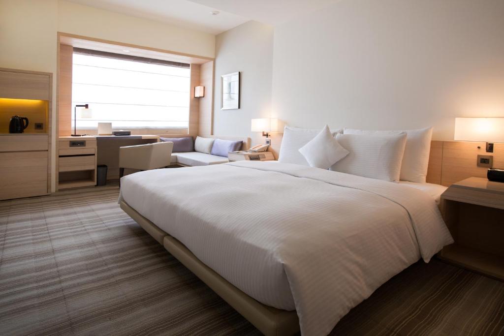 Postel nebo postele na pokoji v ubytování Hotel COZZI Zhongxiao Taipei