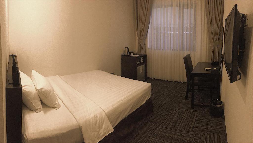 TV a/nebo společenská místnost v ubytování Sakura Hotel 3