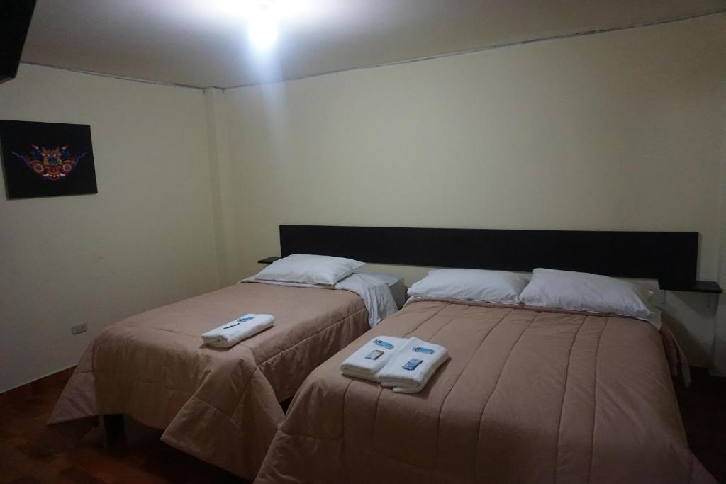 Postel nebo postele na pokoji v ubytování Residencial Mamamia