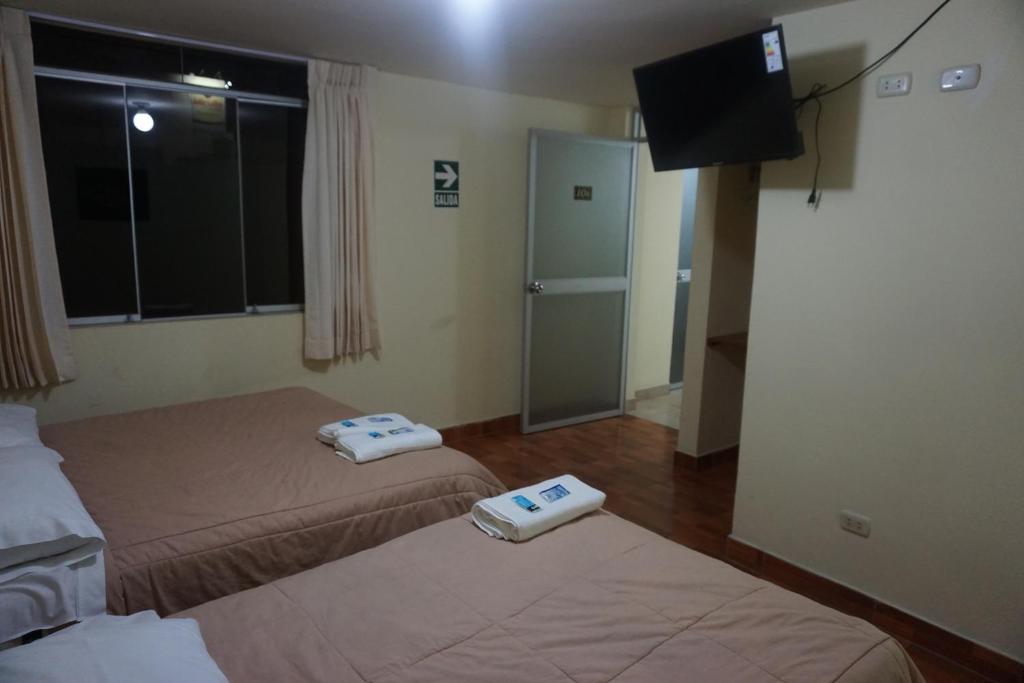 Postel nebo postele na pokoji v ubytování Residencial Mamamia
