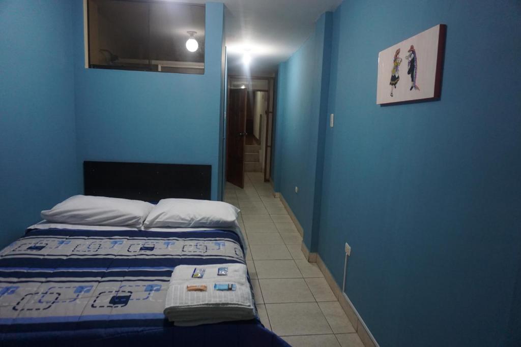 Postel nebo postele na pokoji v ubytování Residencial Mamamia