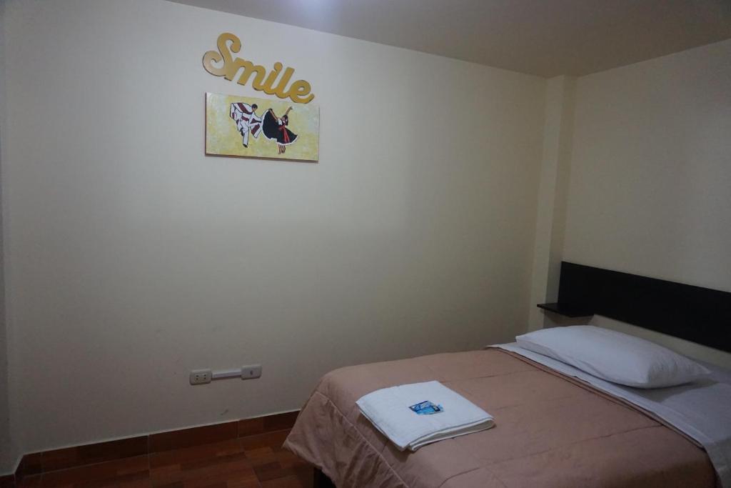 Postel nebo postele na pokoji v ubytování Residencial Mamamia