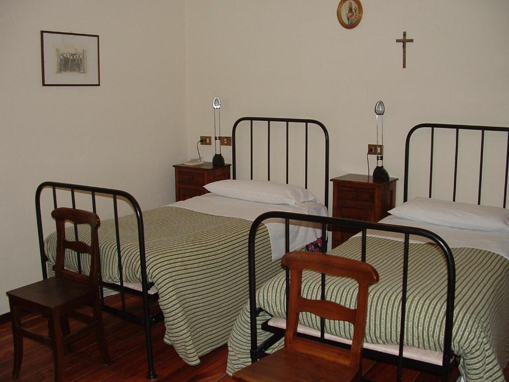 Postel nebo postele na pokoji v ubytování Santuario di Oropa