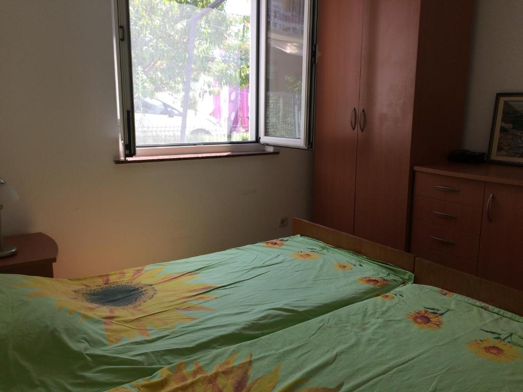 Postel nebo postele na pokoji v ubytování Dragica Apartments
