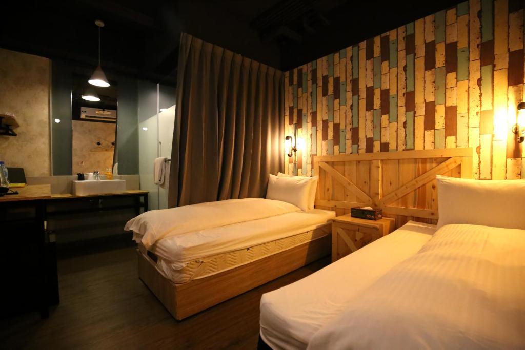 Postel nebo postele na pokoji v ubytování NYS Loft Hotel