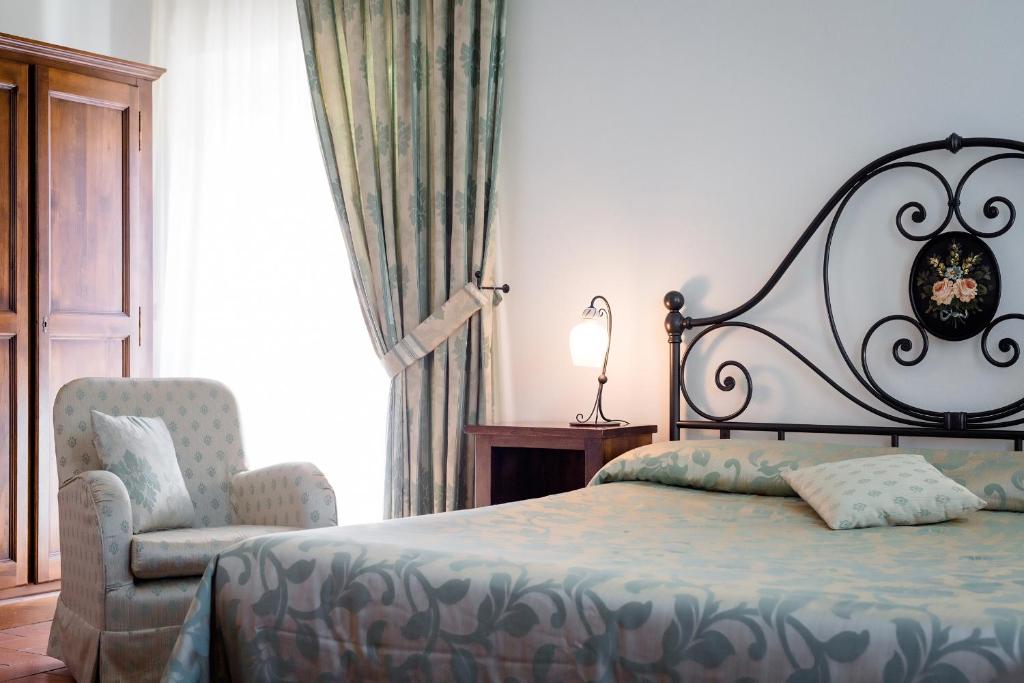 Posteľ alebo postele v izbe v ubytovaní Dimora Palazzo La Fenice