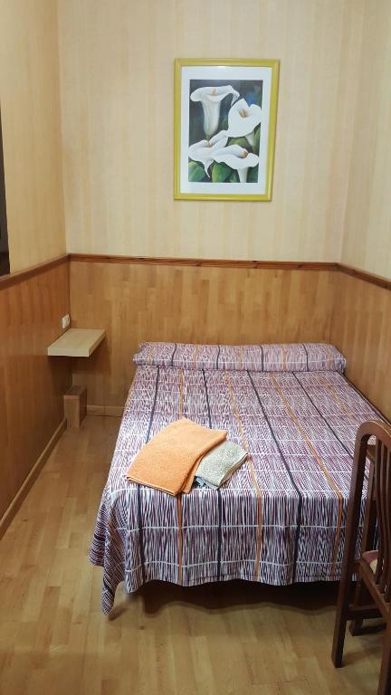 Postel nebo postele na pokoji v ubytování Pensión Villanueva