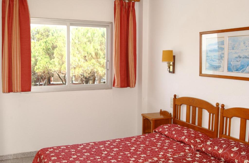 Postel nebo postele na pokoji v ubytování Apartamentos Quintasol