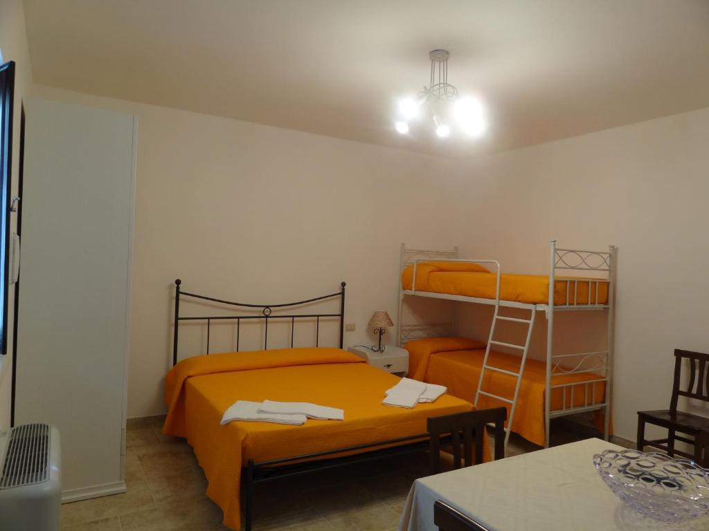 Postel nebo postele na pokoji v ubytování Trulli la macchia