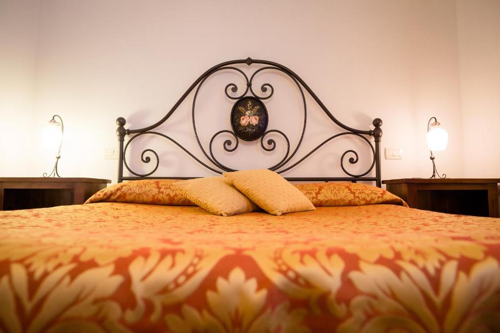 Posteľ alebo postele v izbe v ubytovaní Dimora Palazzo La Fenice