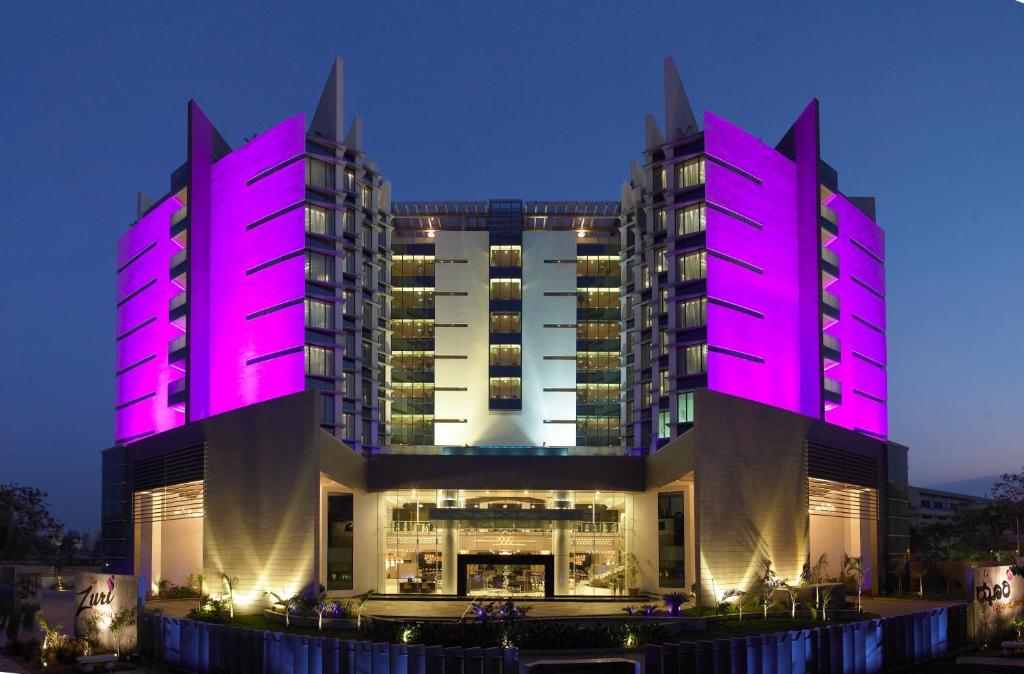a large building with purple lights on it at The Zuri Whitefield Bengaluru in Bangalore