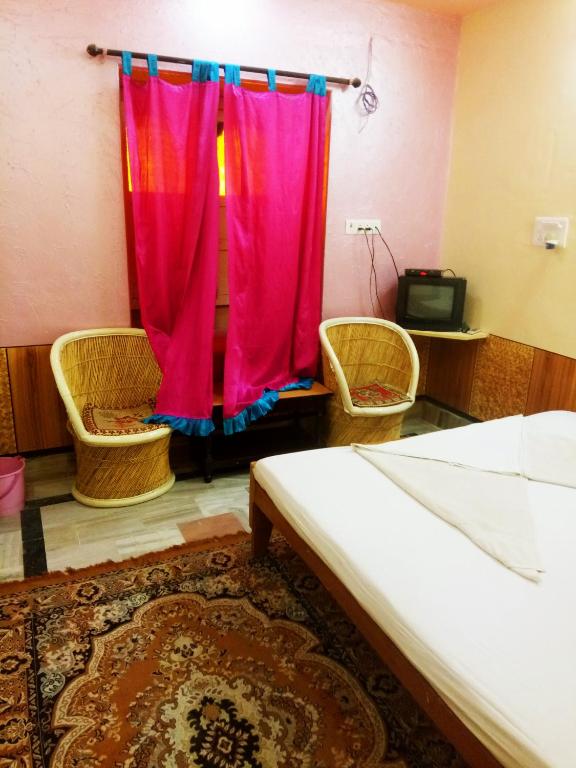 Postel nebo postele na pokoji v ubytování Hotel Paradise
