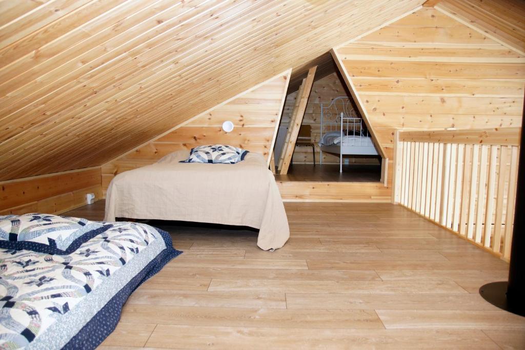 Кровать или кровати в номере Villa Kuukkeli