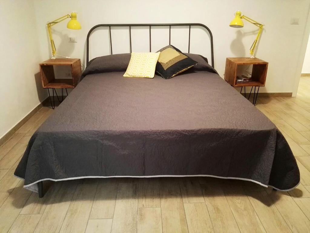 Postel nebo postele na pokoji v ubytování Napoli Boulevard B&B