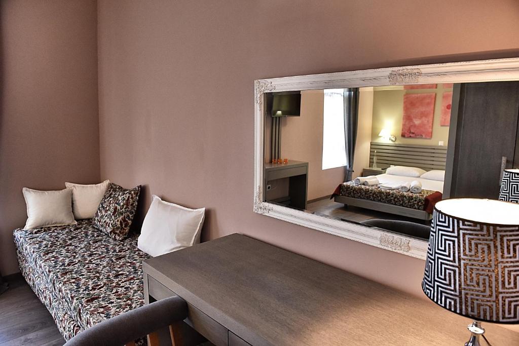 Postel nebo postele na pokoji v ubytování Melina Hotel - Central