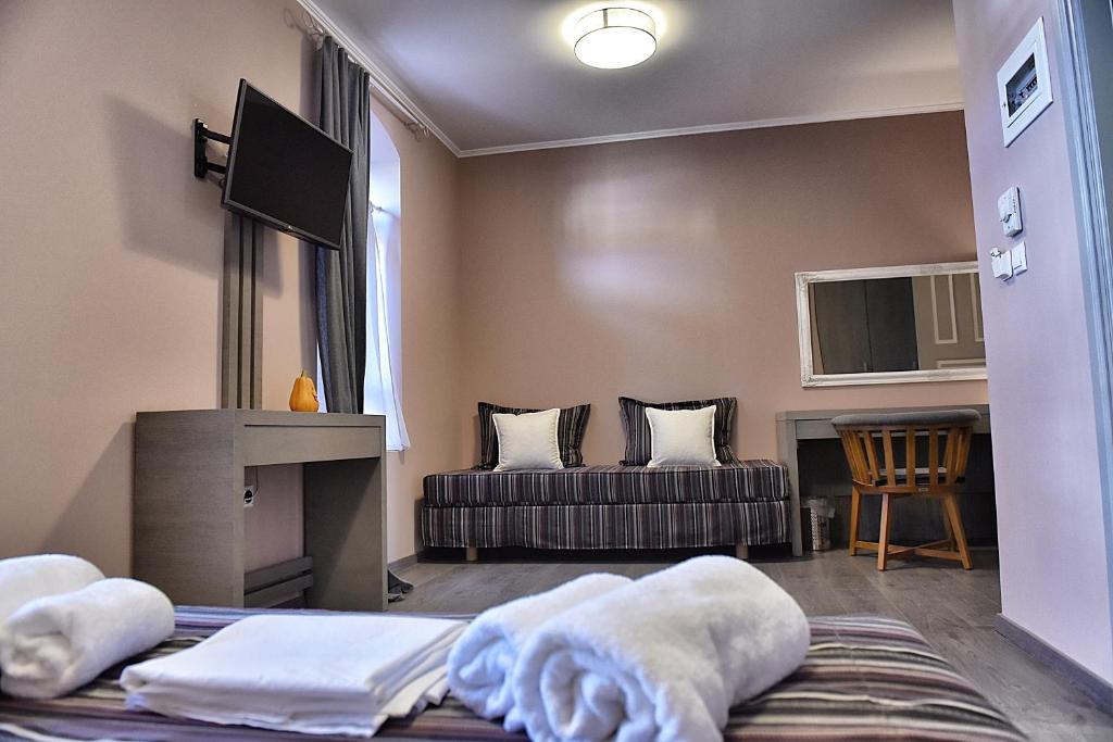 Postel nebo postele na pokoji v ubytování Melina Hotel - Central