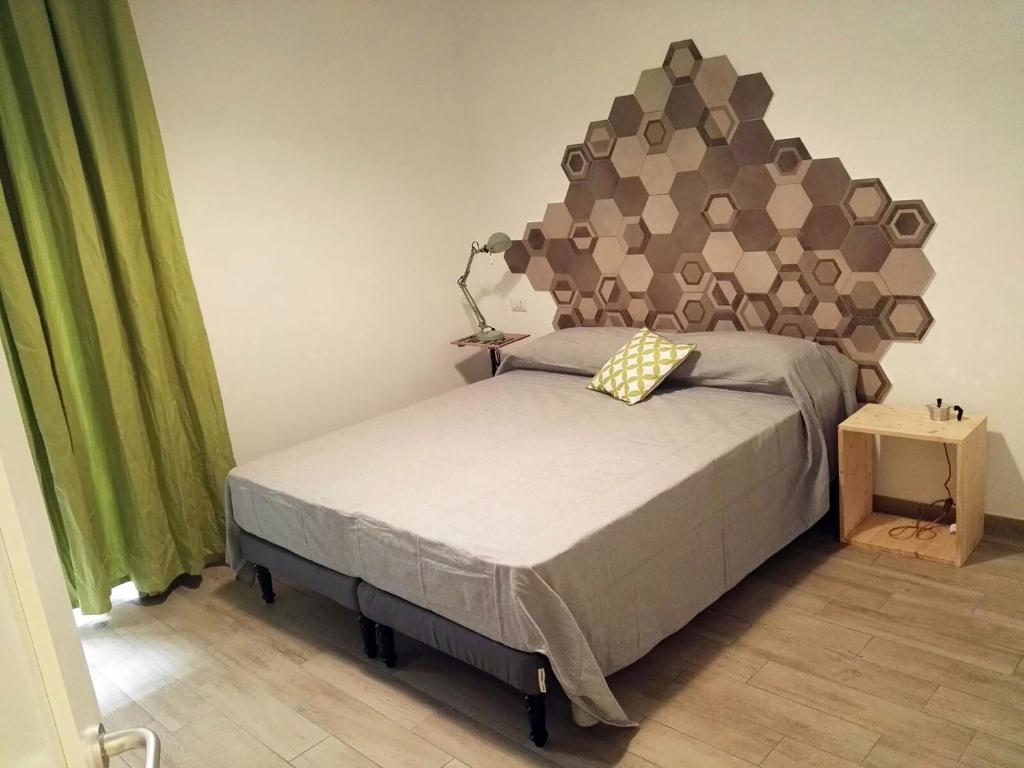 Postel nebo postele na pokoji v ubytování Napoli Boulevard B&B