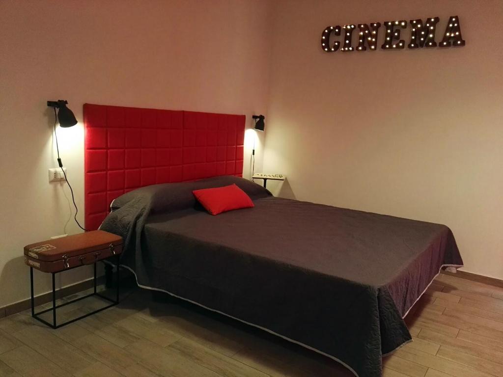 Postel nebo postele na pokoji v ubytování Napoli Boulevard B&B