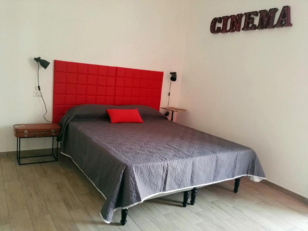 Postel nebo postele na pokoji v ubytování Napoli Boulevard B&B