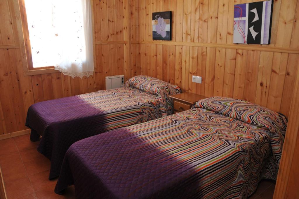 Łóżko lub łóżka w pokoju w obiekcie Alojamientos Rural Tejerina