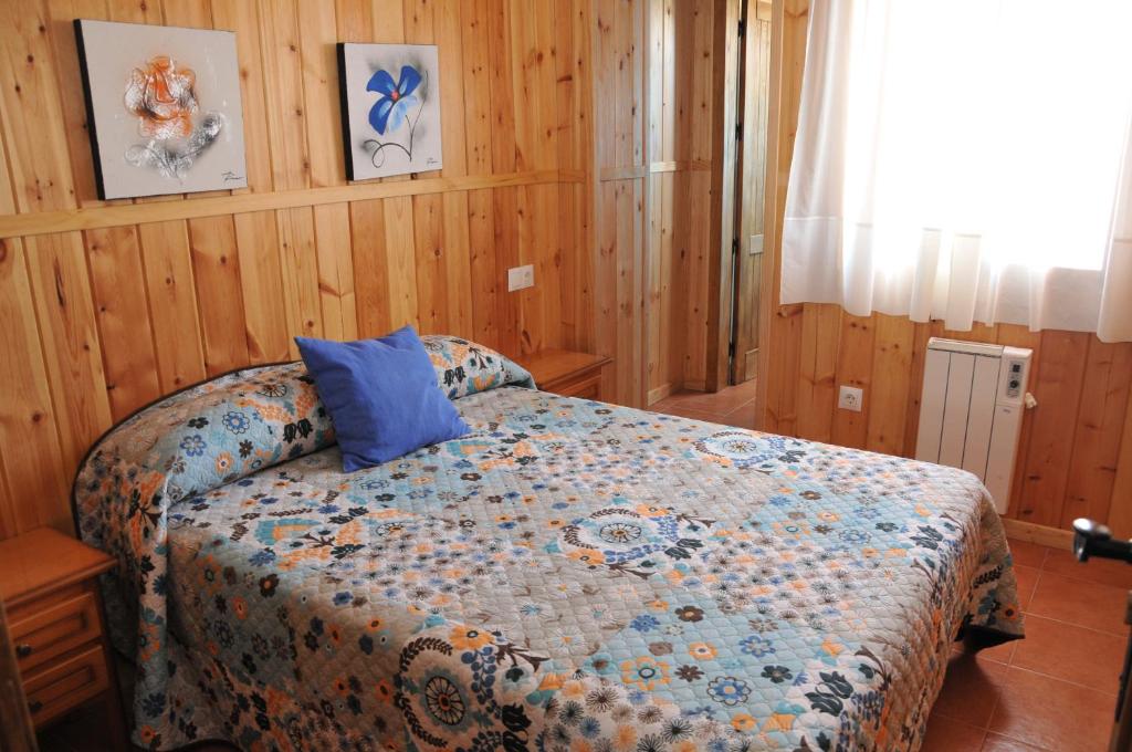 Łóżko lub łóżka w pokoju w obiekcie Alojamientos Rural Tejerina