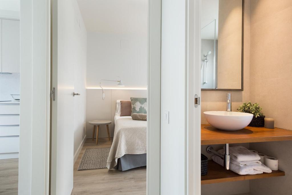 A bed or beds in a room at Sitges Group Calm Beach